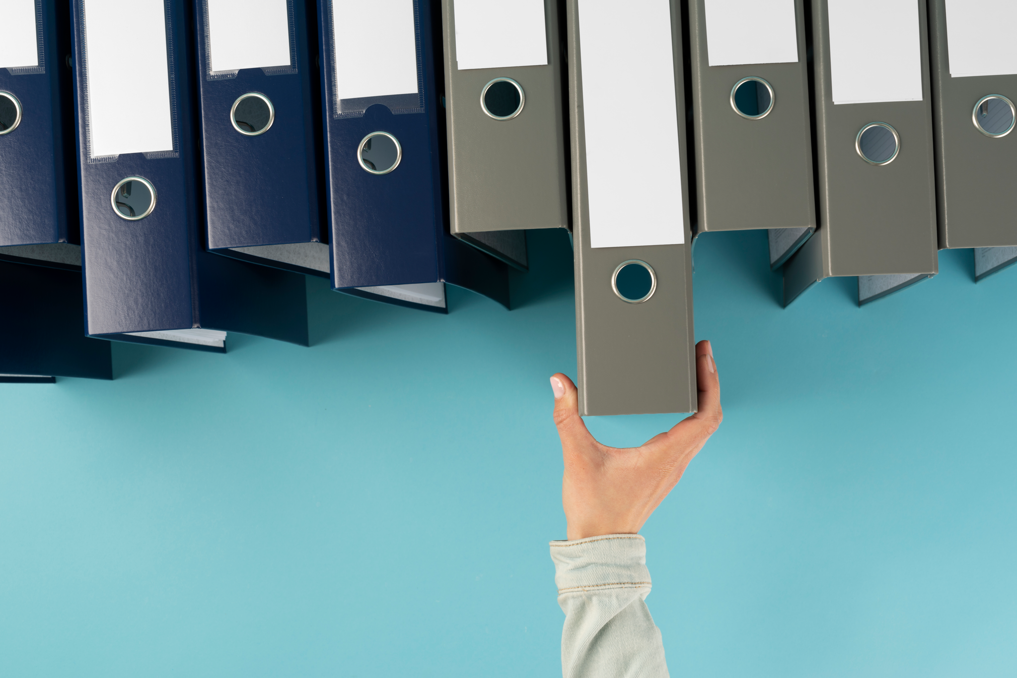 Hand reaching for binder