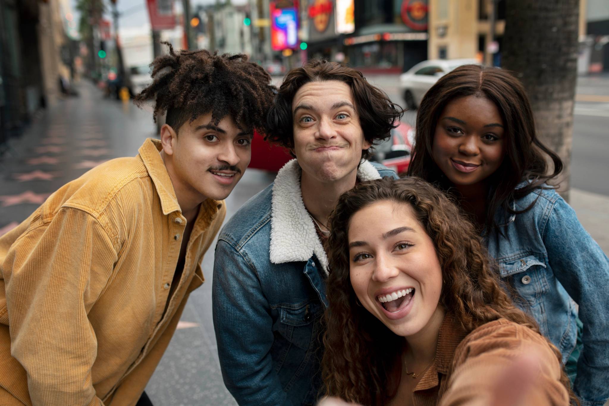 Woman taking selfie with friends while out in the city