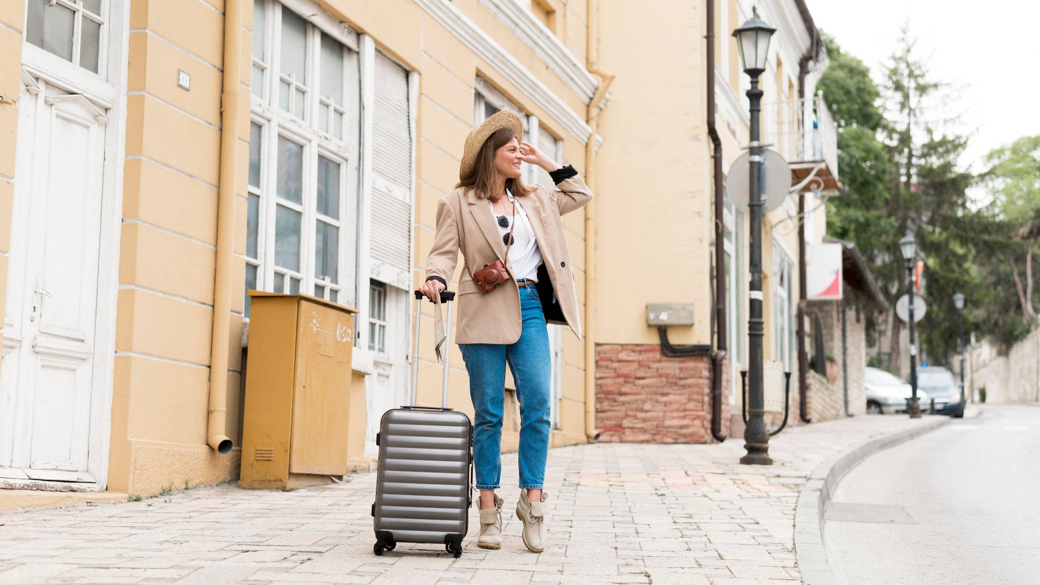 woman smiling with luggage