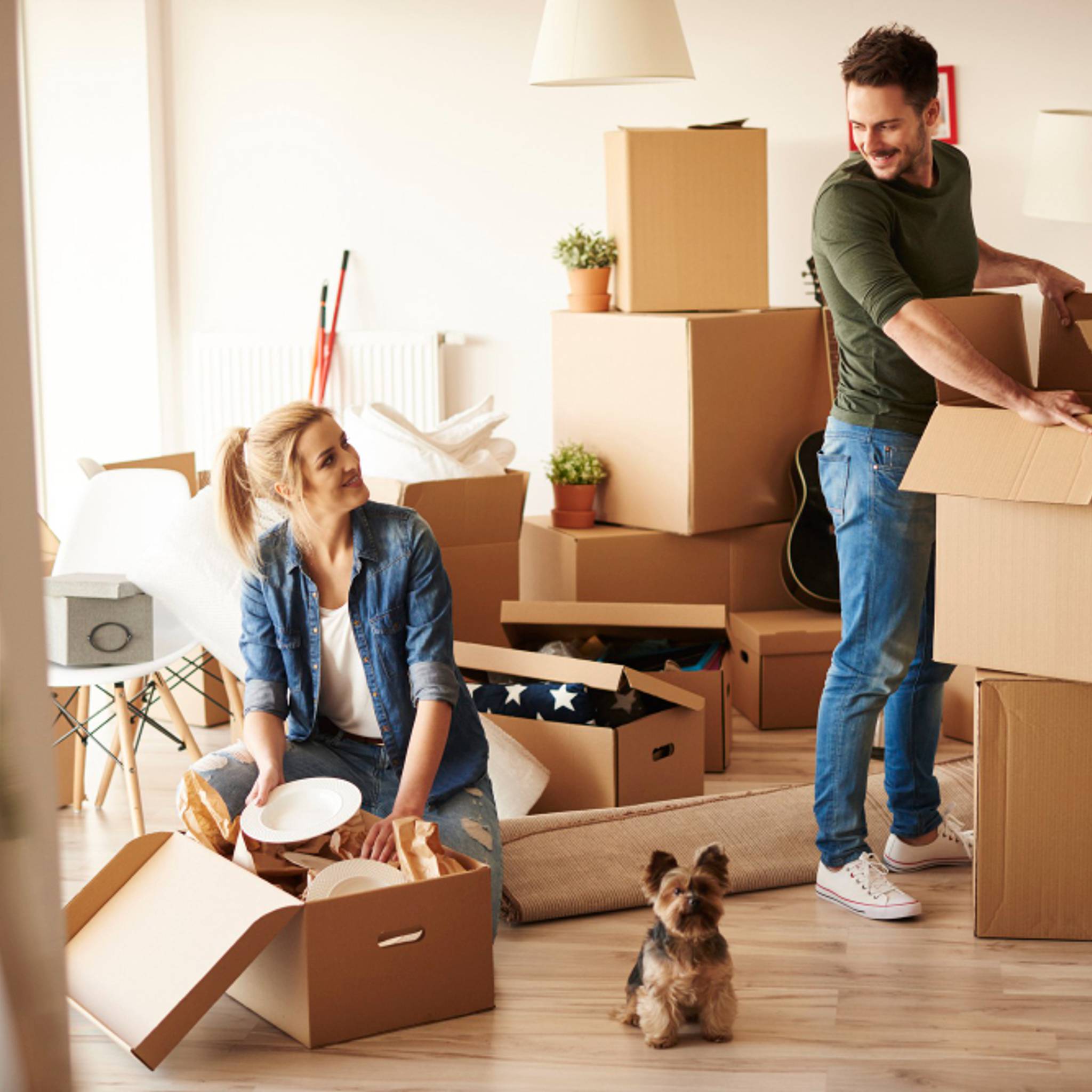 couple packing for moving home