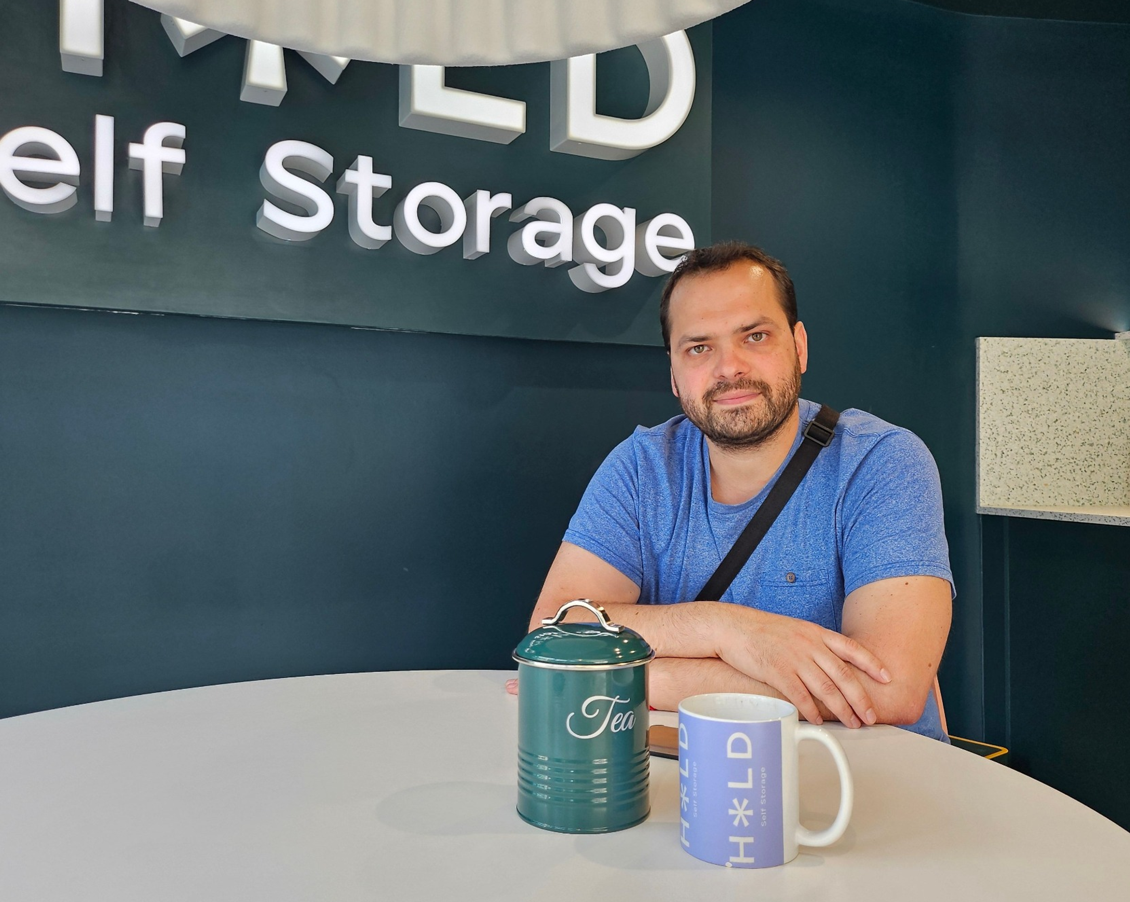Man sitting at table with coffee mug