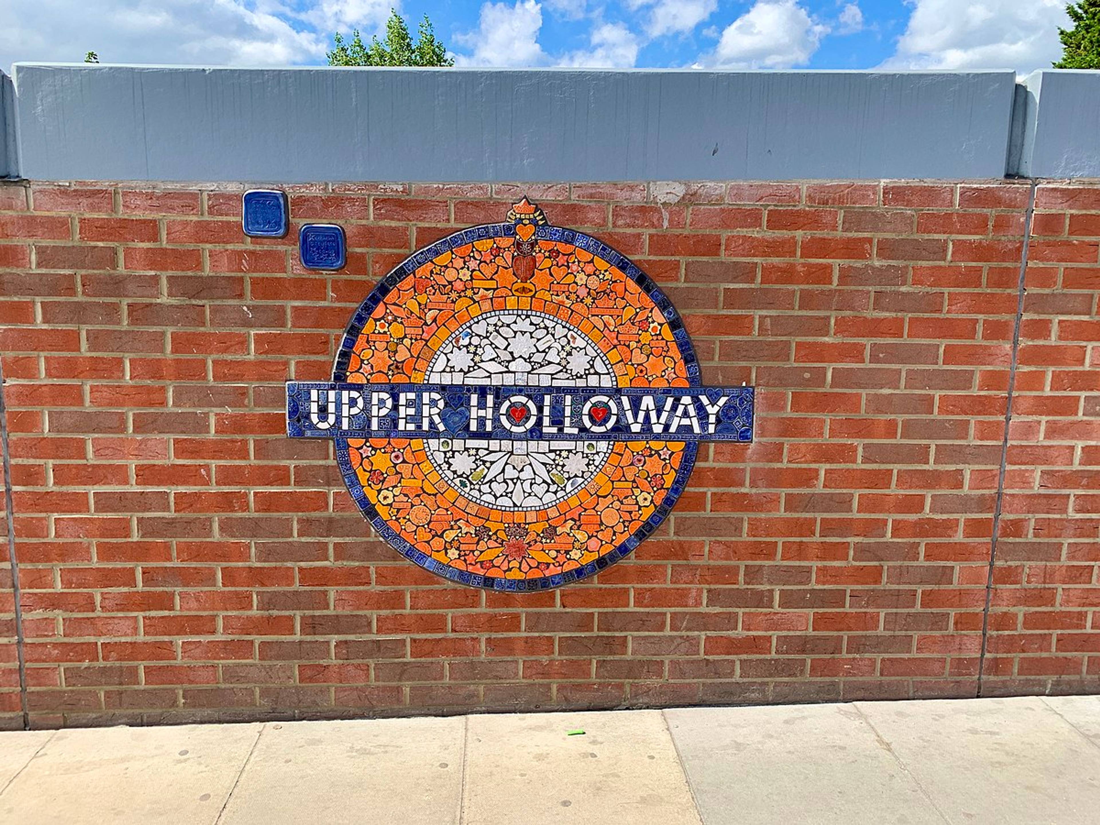 mosaic of underground sign on wall