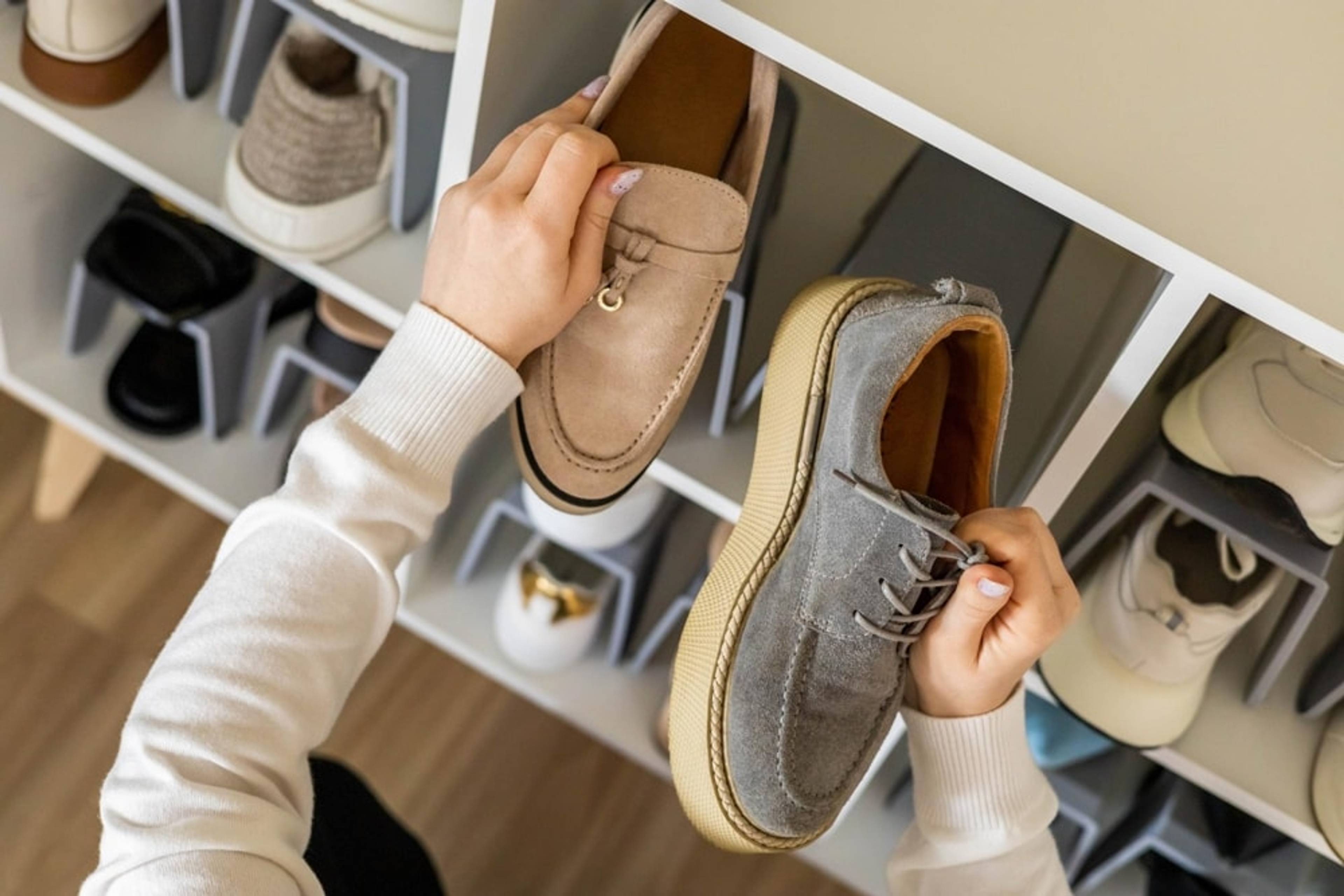 shoes on a rack with woman holding them