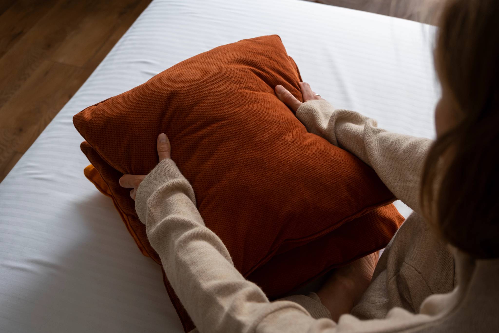 Woman fixing pillow