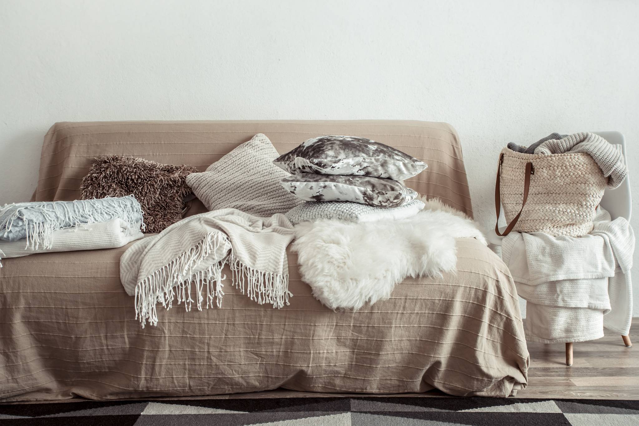 A sofa with several decorative pillows