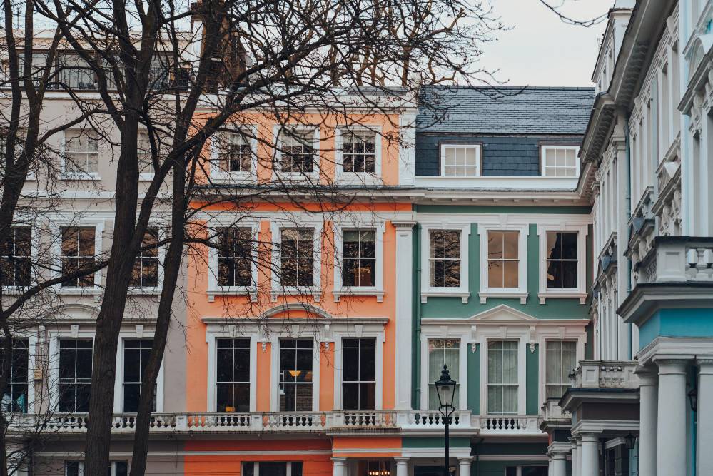Pastel coloured terraced houses in primrose hill london uk