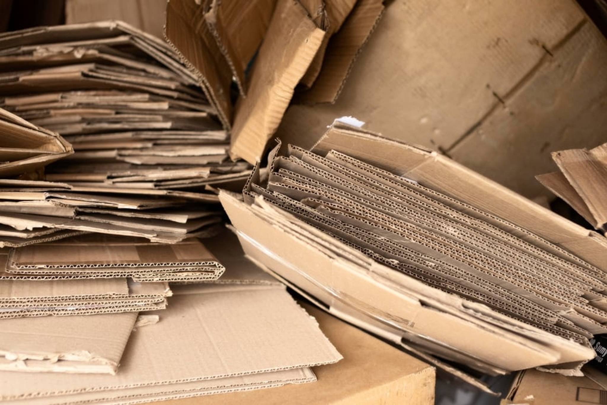 Messy and disorganised cardboard boxes on the floor