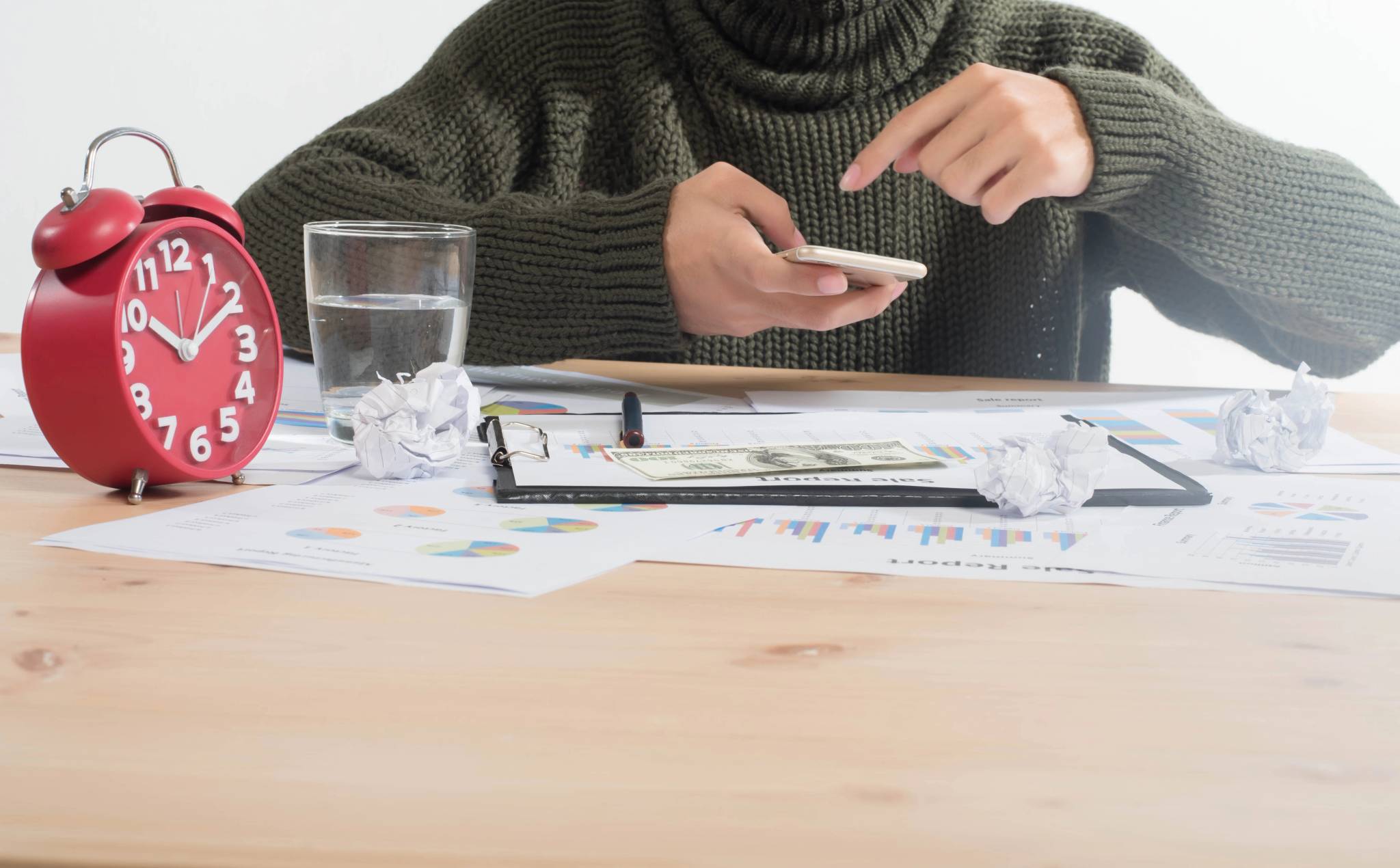 A man analyzing graphs with his phone.