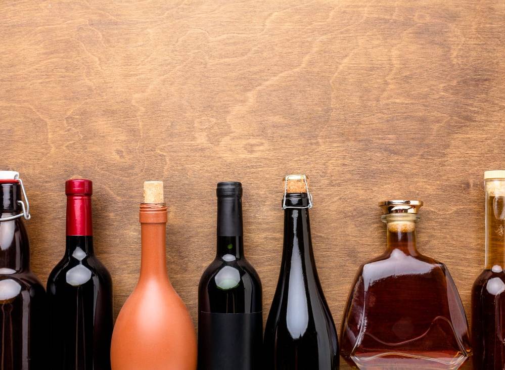 A top view of a ix of different alcohol bottles