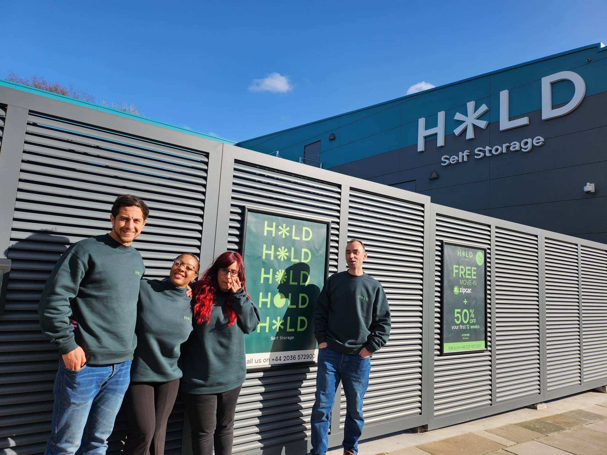 HOLD staff standing outside facility