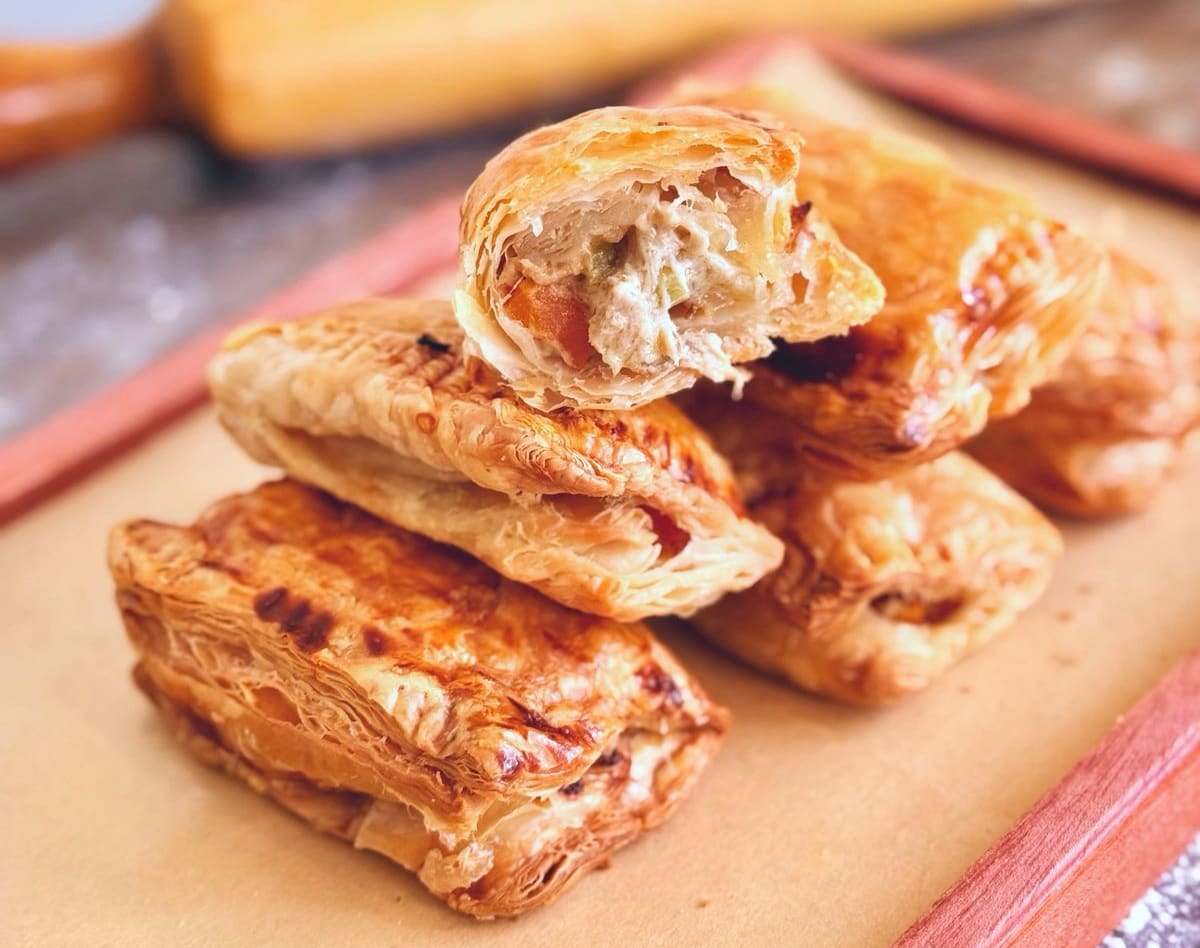 Flaky puff pastries filled with creamy tuna and vegetables.