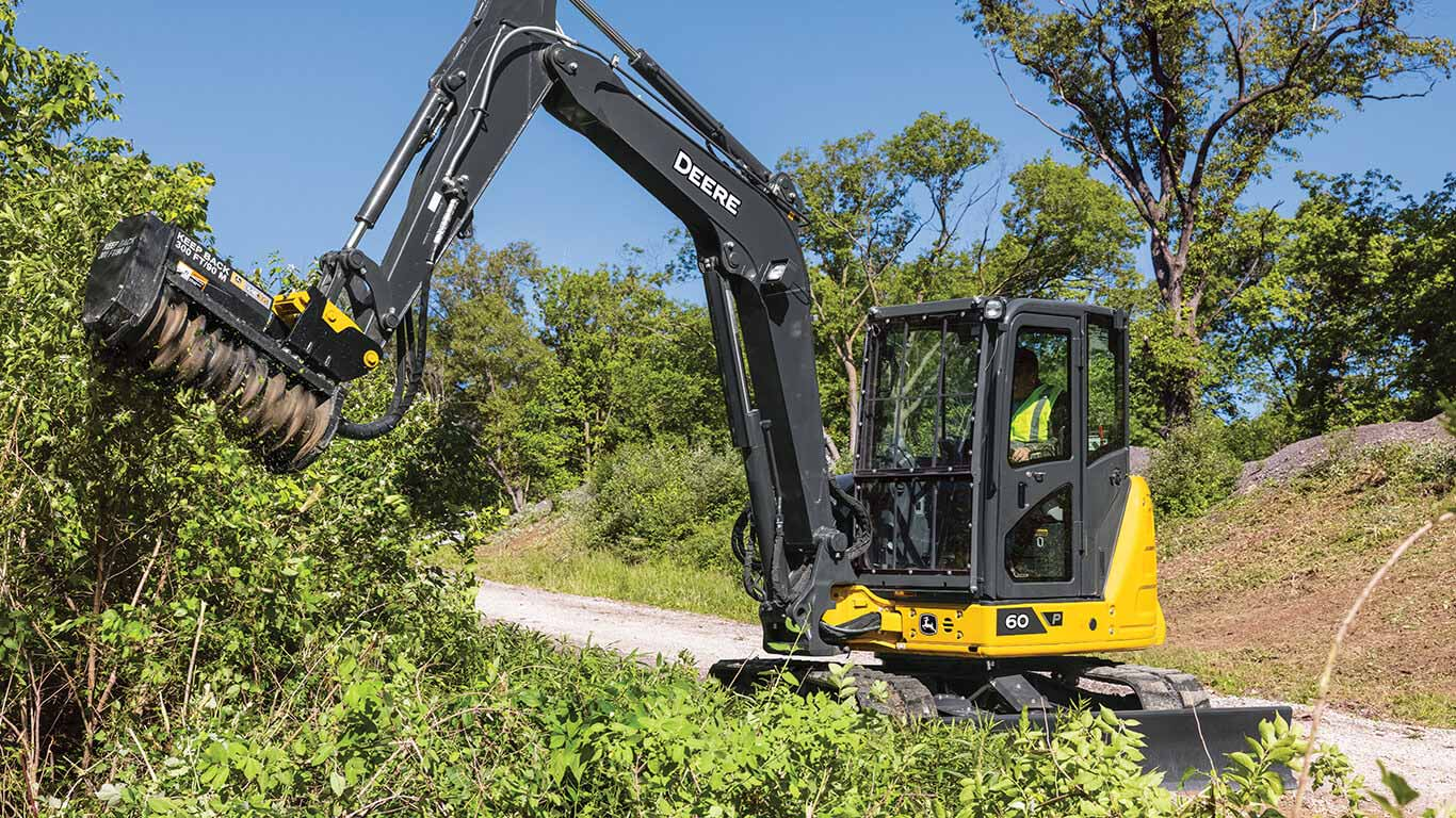 forestry equipment rental excavator clearing land for logging road development