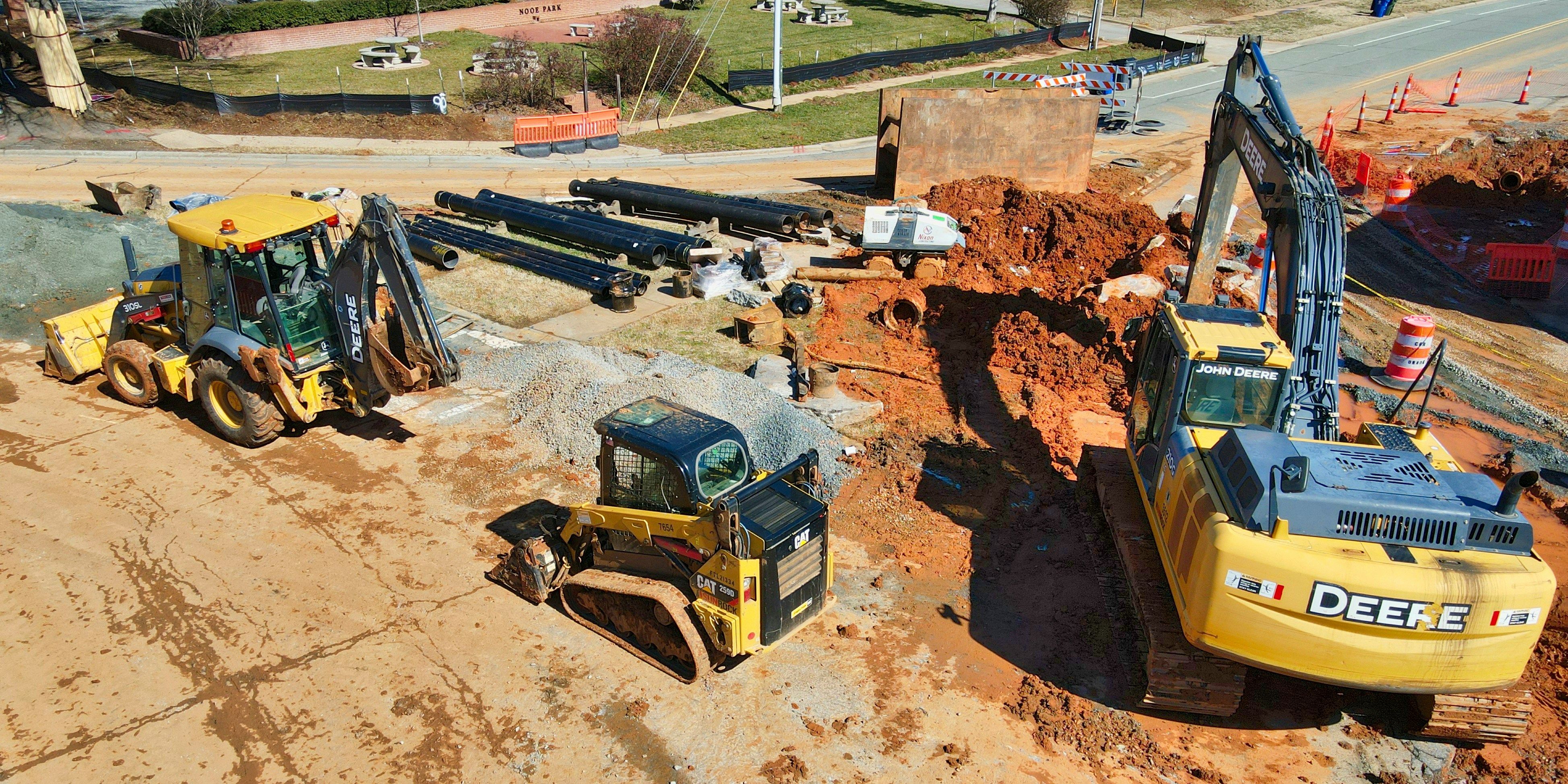 motor grader performing precision grading for road construction project