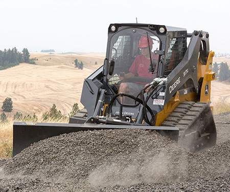 A photo of a bulldozer in use as it moves dirt.