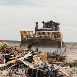 What is a telehandler telescopic handler lifting a pallet on a construction site