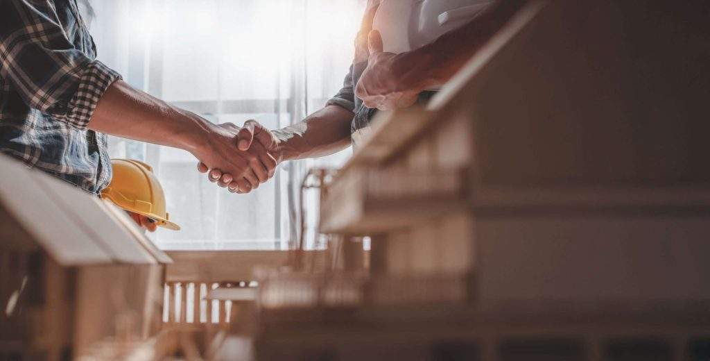 image of a handshake - learn how to insure rental equipment with Five Star Equipment