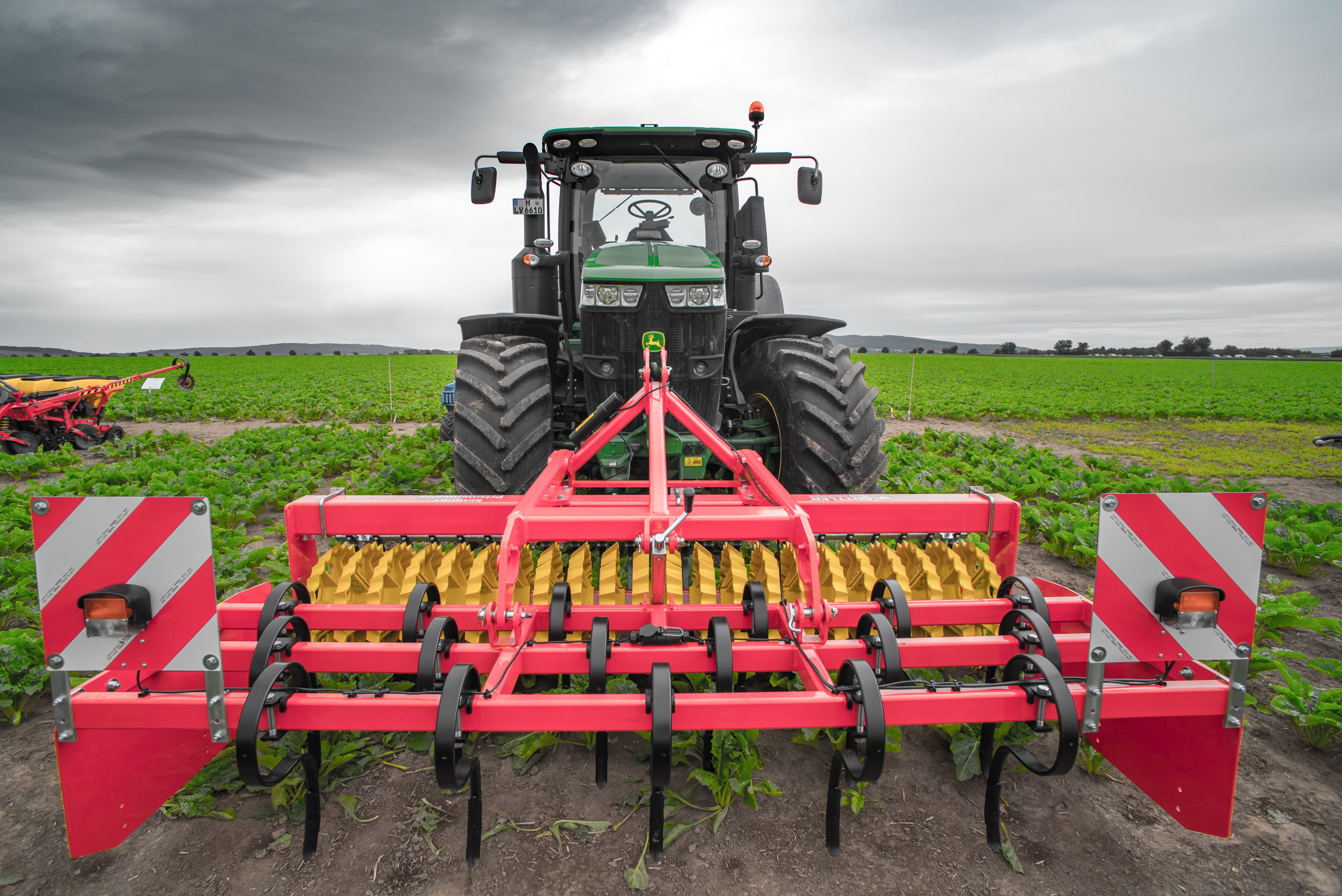 Agricultural equipment operating on farmland in Pennsylvania and New York