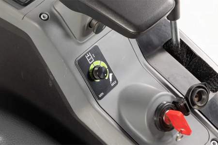 Knob under arm rest to adjust flow
