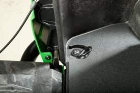 Integrated tie-down point in cargo box bed