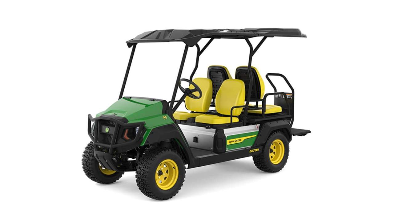 A green Gator with four yellow seats facing front-left on a white background.