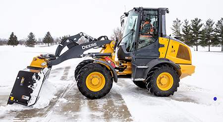 SP10C featured on 244L removing snow from parking spot