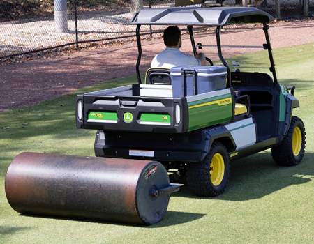 GX Electric towing a lawn roller