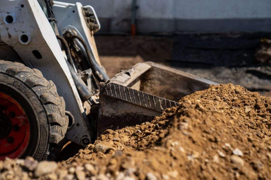 image of skid steer at work - learn about skid steer lift capacity with Five Star Equipment, a construction equipment supplier serving Pennsylvania and New York.