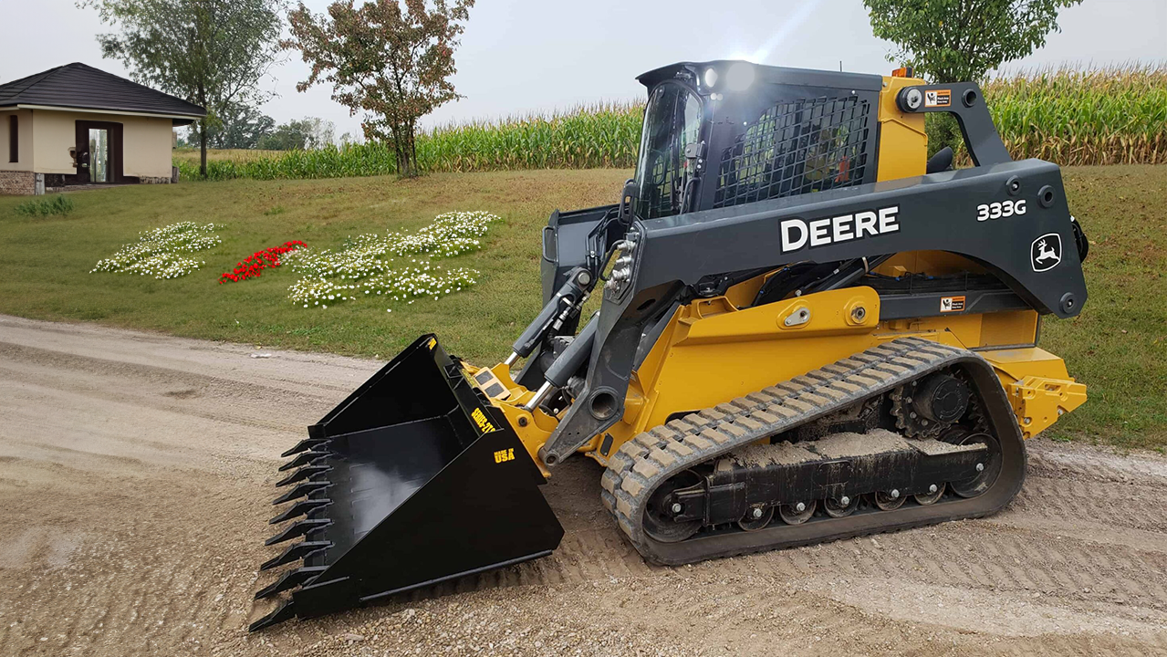 Skid steer handling timber logs with grapple attachment