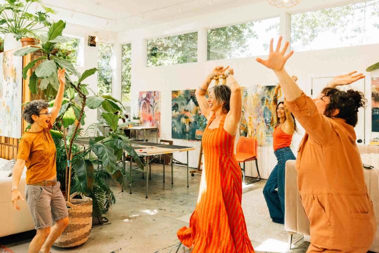 Flora Bowley painting with her community