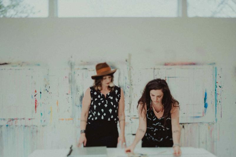Student working on original paintings in Fresh Paint online course