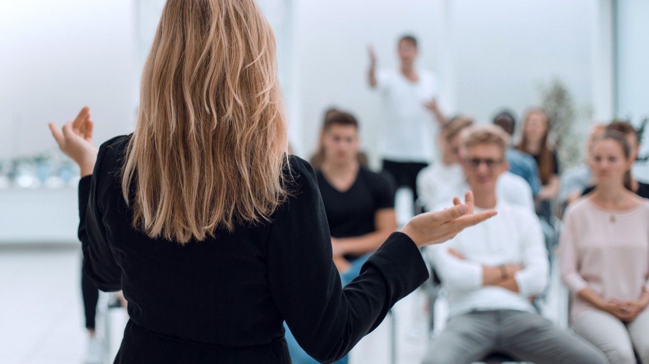 Instructor leading a cyber awareness training session.