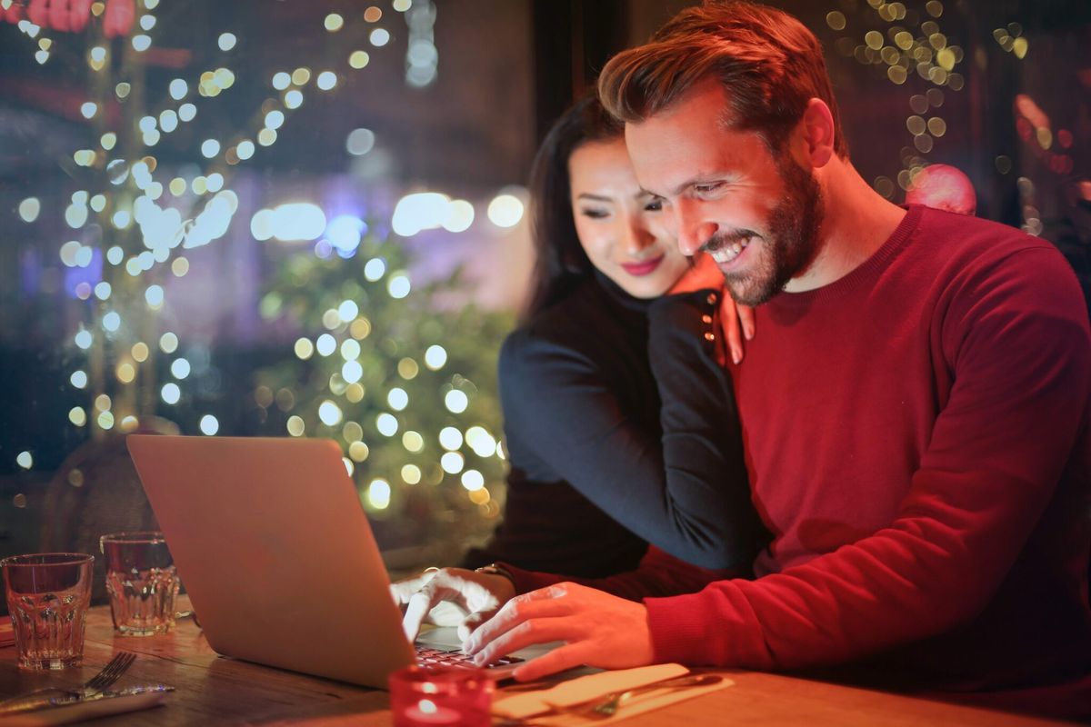 Couple working together on a laptop