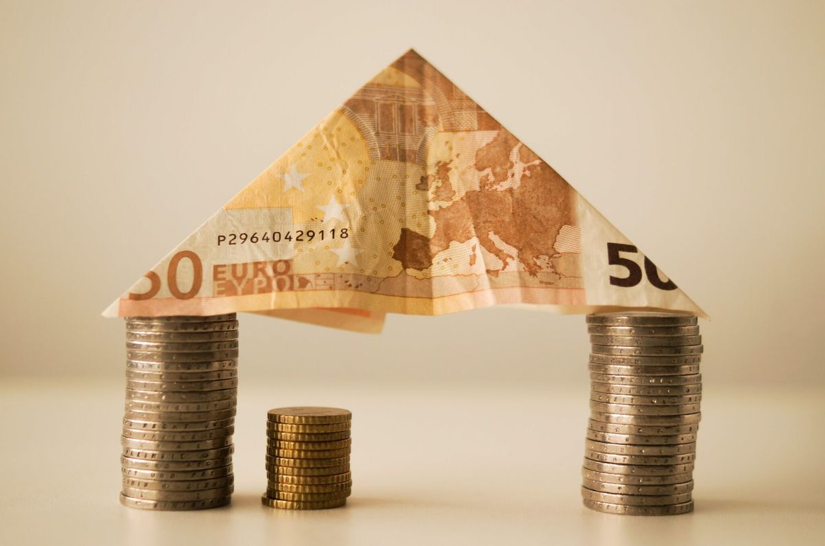 Model house made with banknotes and coins