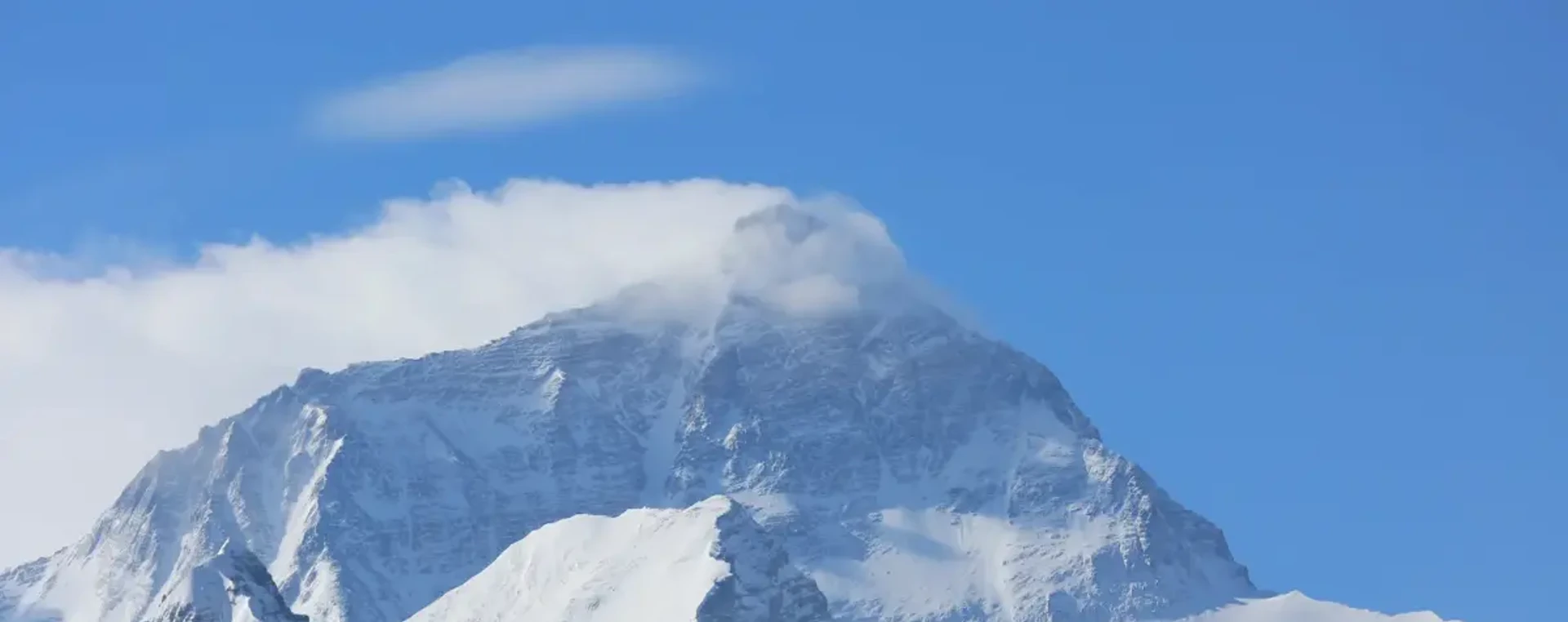 Snow-capped Mount Everest under a clear blue sky