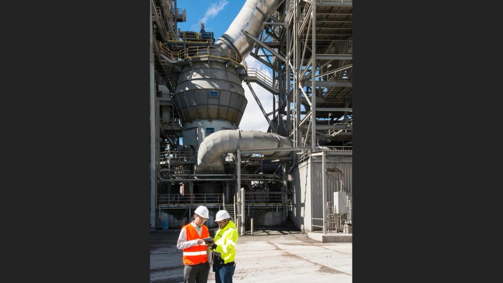 VRMs produce narrower particle size distributions through integrated high-efficiency classification, which is critical for high-SCM blends