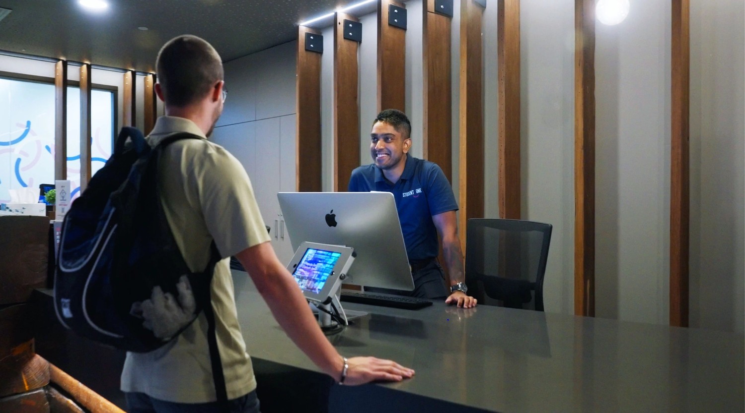 Student One Elizabeth St Reception - Team member helping student