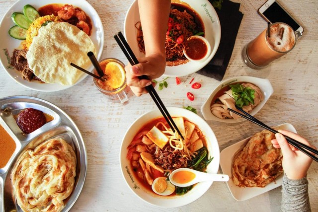 Top view of a table full of asian food