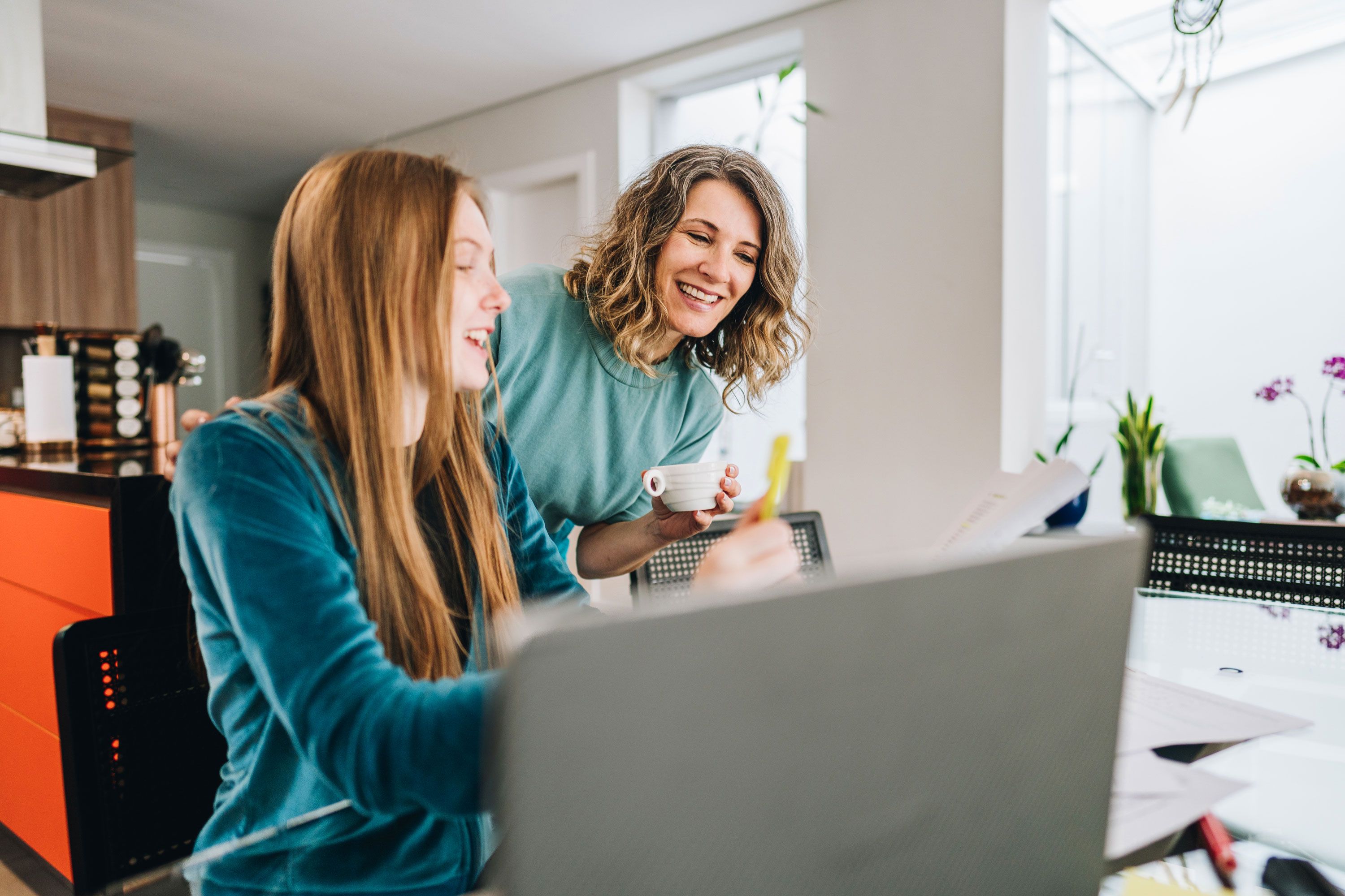 Mother and daughter looking at computer