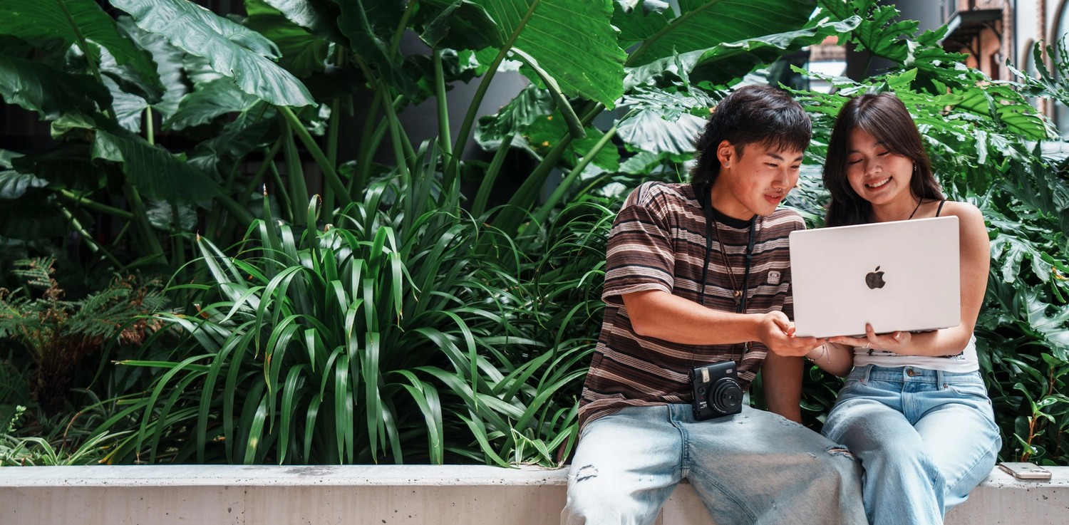Under 18 International Students working on a laptop together