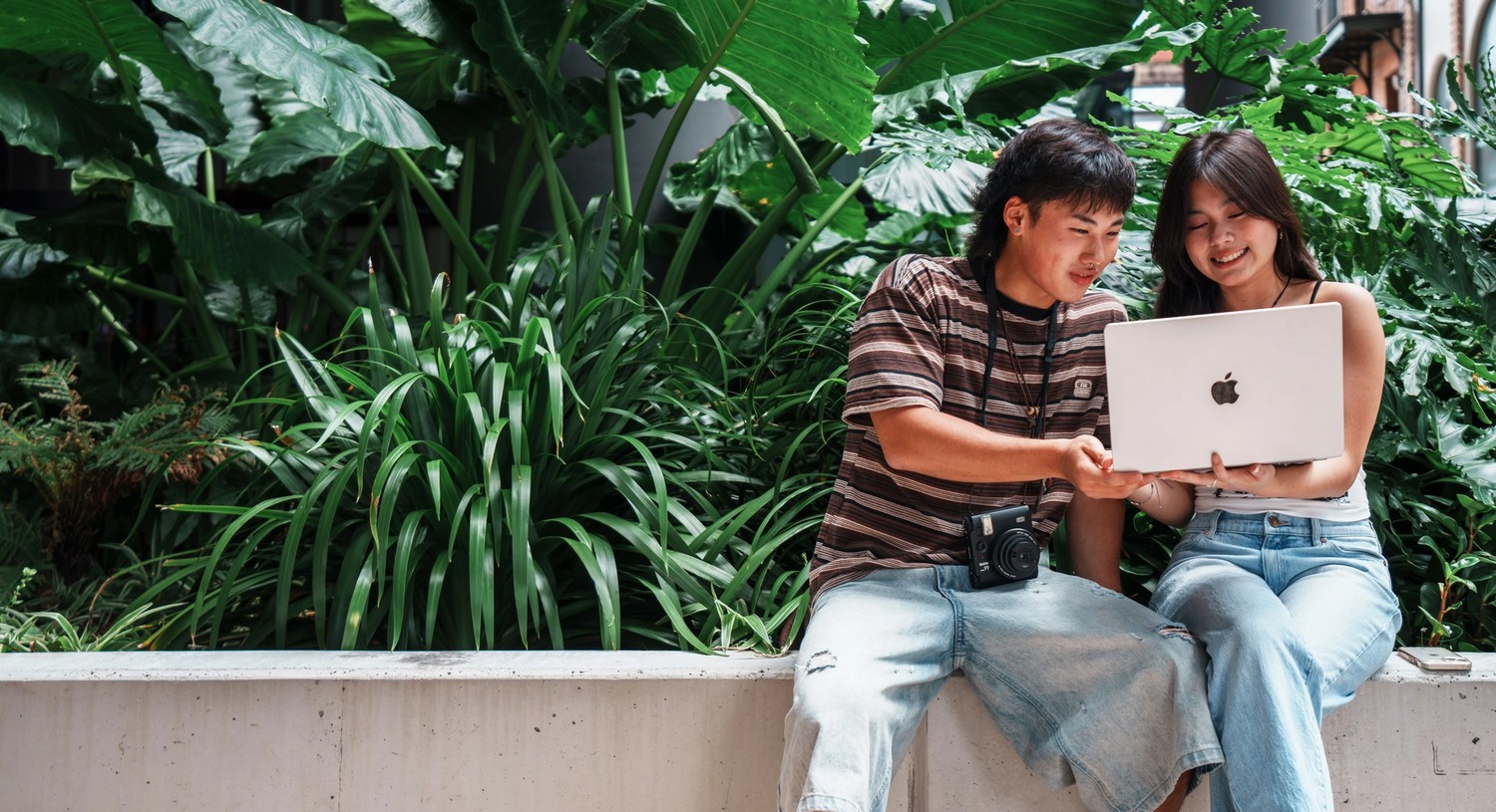 Under 18 International Students working on a laptop together