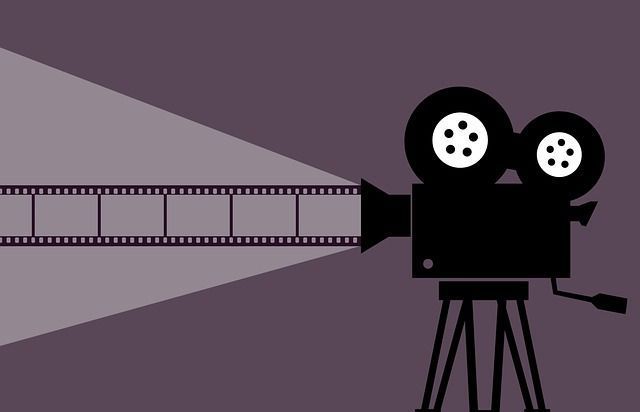 Illustration of a vintage film camera projecting a strip of film