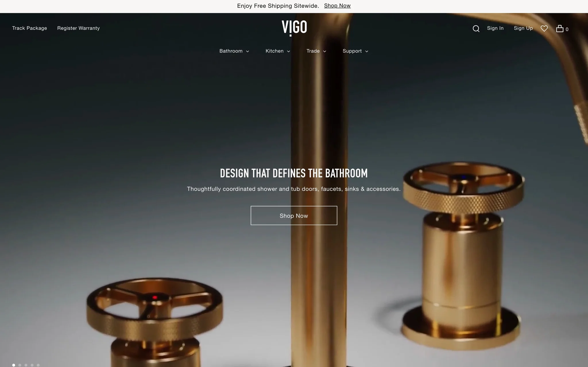 VIGO homepage hero with a brushed-gold bathroom faucet, the headline Design That Defines the Bathroom and Bathroom, Kitchen, Trade and Support menus.