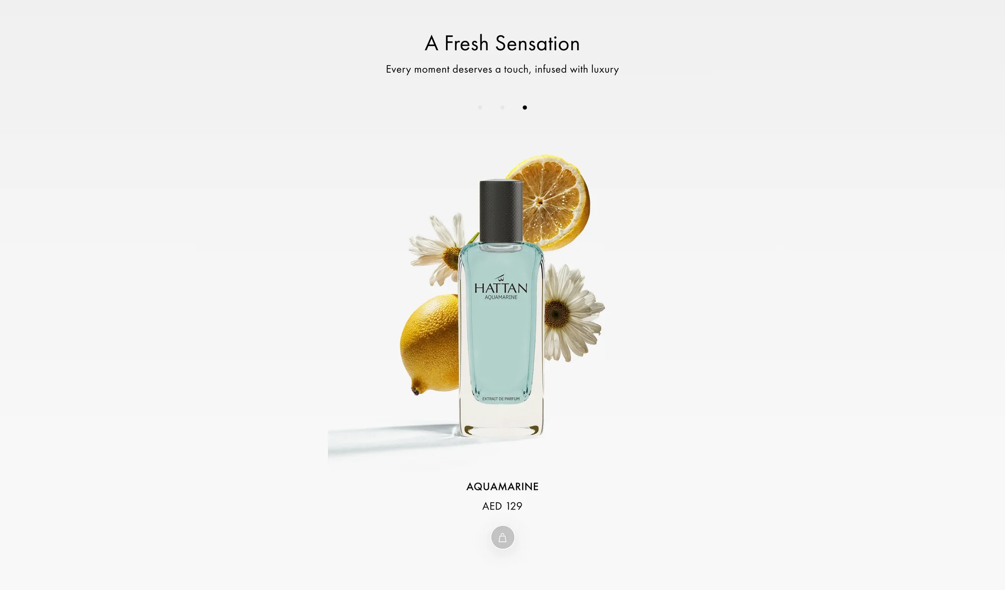 The same slider moved on to its third slide: the pale blue Aquamarine bottle with lemons and daisies at AED 129