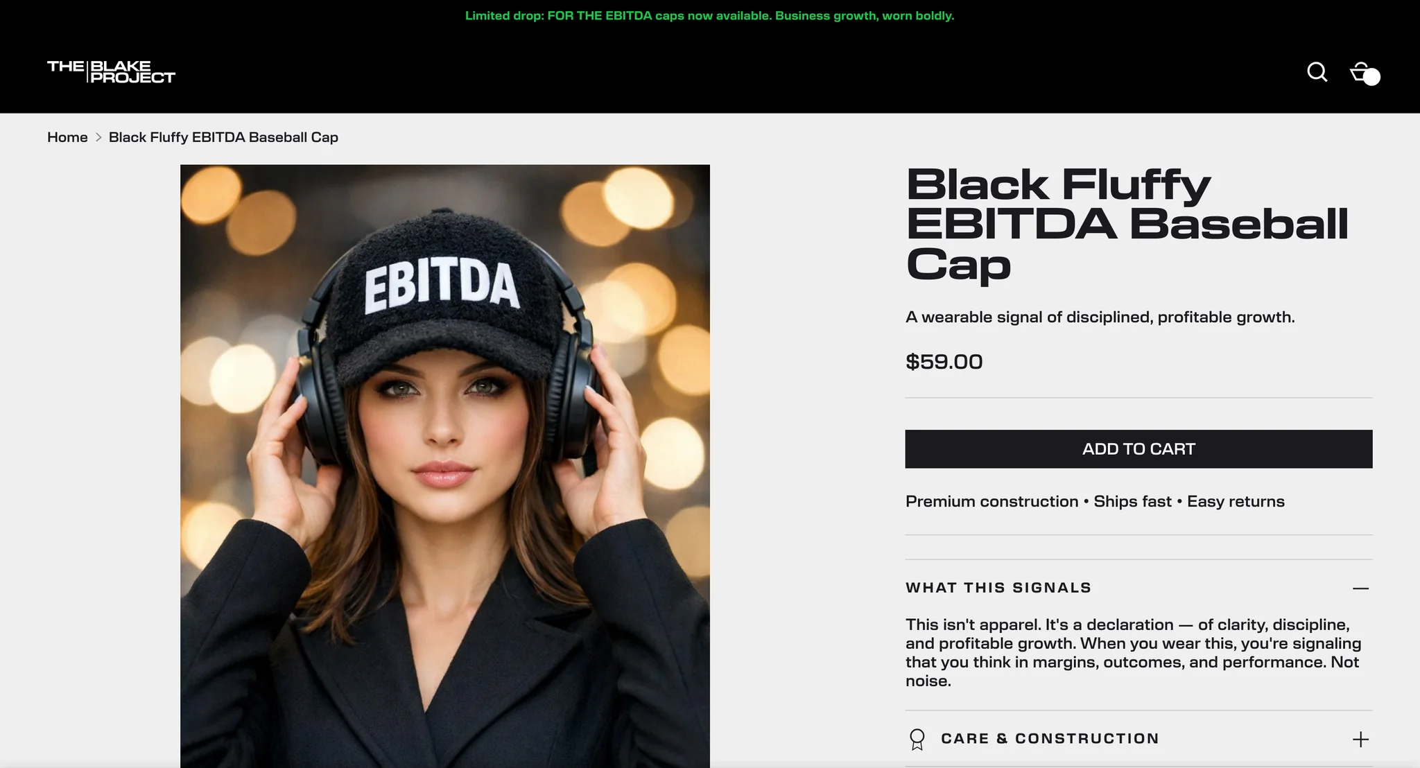 Black Fluffy EBITDA Baseball Cap product page with a photo of a woman wearing the cap and headphones, the price and add to cart