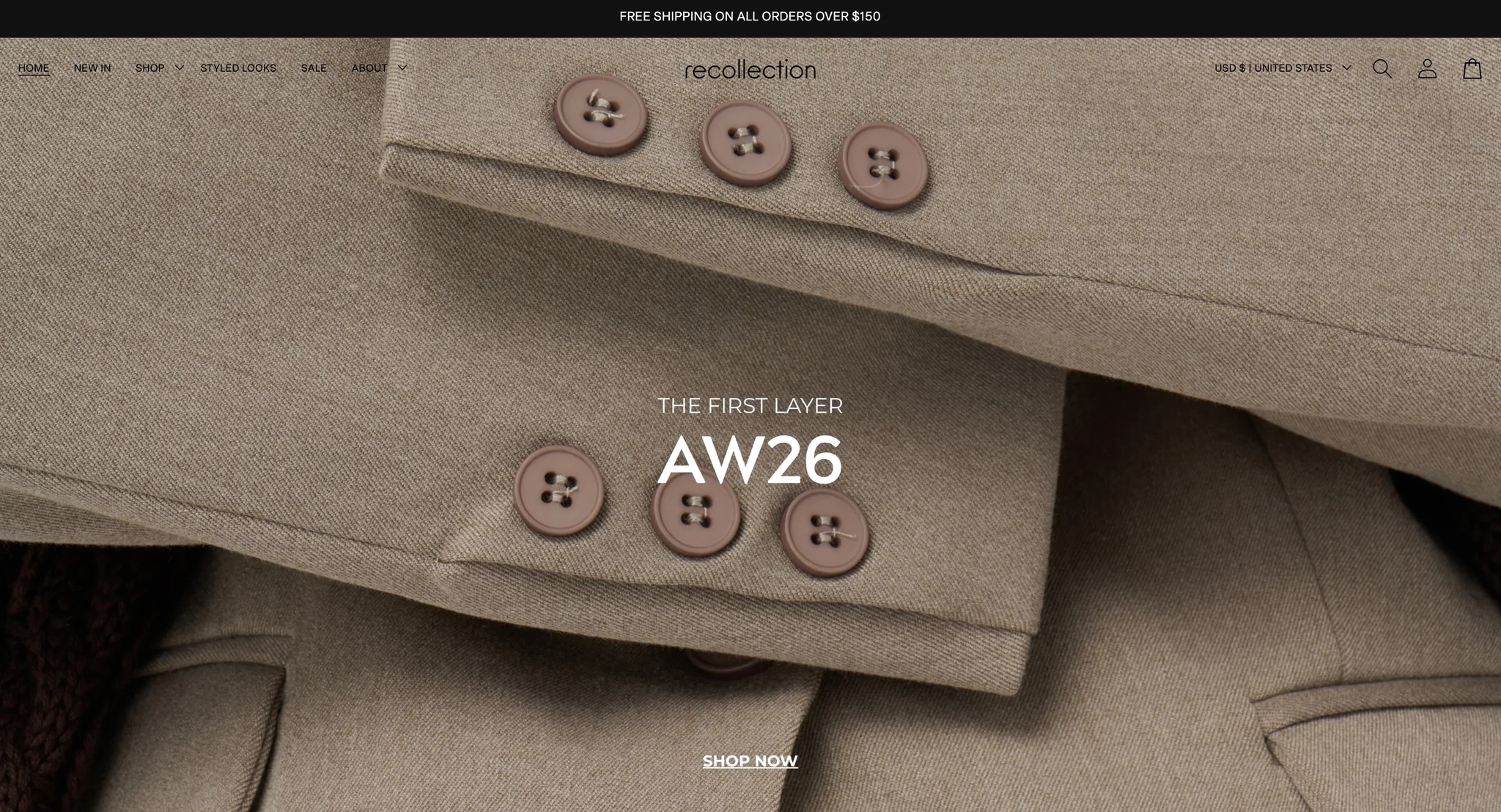 Recollection homepage first screen: a black bar offering free shipping on orders over $150, the Home, New in, Shop, Styled Looks, Sale and About menu to the left of the recollection wordmark, and a full-width AW26 "The First Layer" campaign photo of taupe blazer cuffs with mauve buttons and a Shop now link