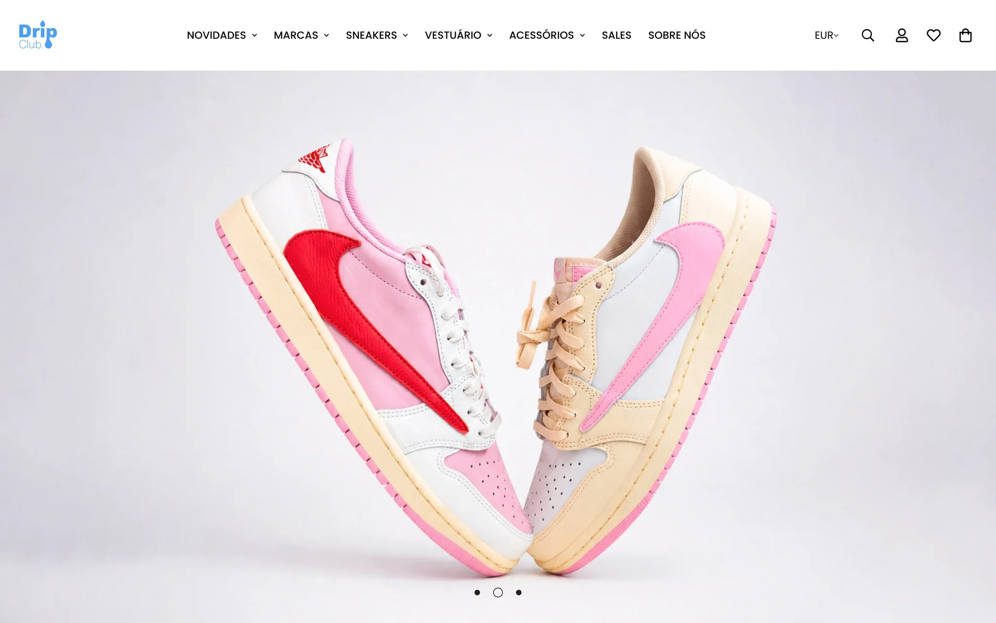 DripClub homepage with mega-menu navigation and a full-width hero slide of pink and cream Air Jordan 1 Low sneakers.
