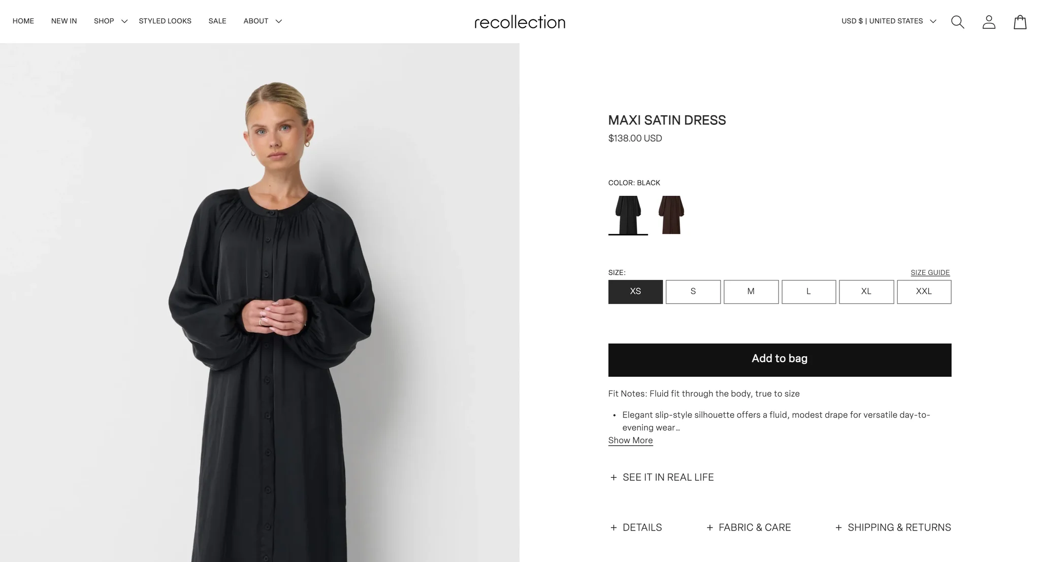 Maxi Satin Dress product page with a model in the black satin dress with full gathered sleeves, beside black and coco brown image swatches, sizes XS to XXL, Add to bag, Fit Notes with Show More, the "See it in real life" toggle and the three tabs