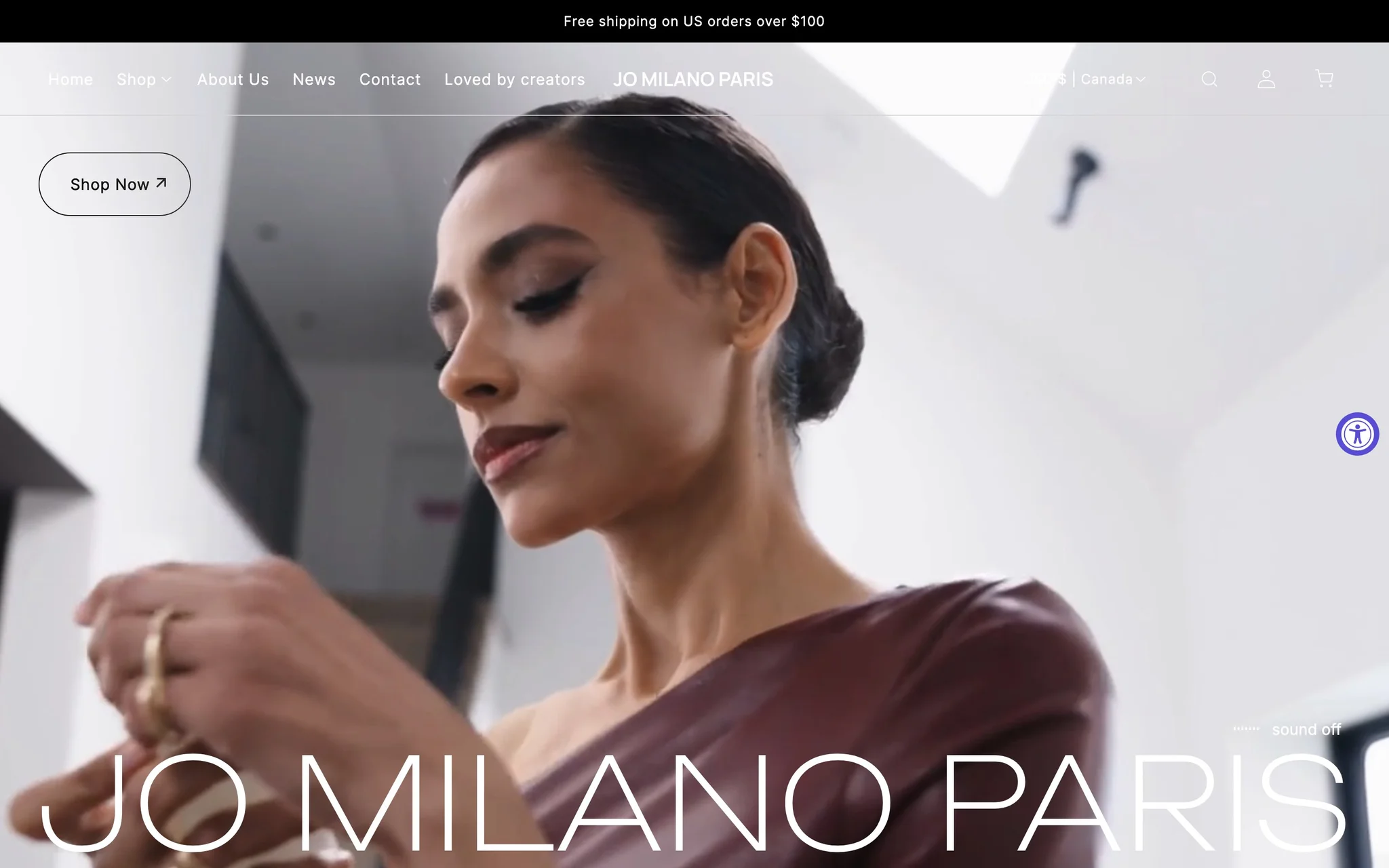 Jo Milano Paris homepage hero with a full-screen fashion video and an oversized JO MILANO PARIS wordmark.