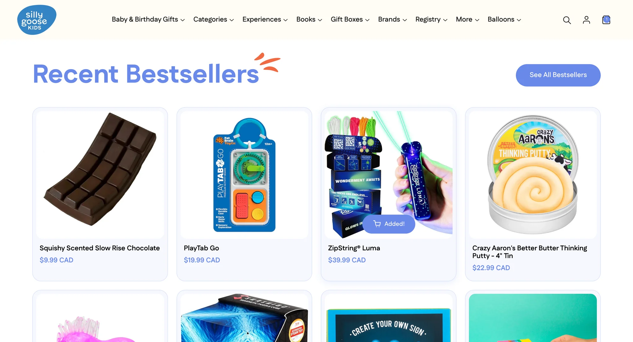 The ZipString Luma card in Recent Bestsellers after a click, its button now reading "Added!" and the cart icon in the header showing a count, with the shopper still on the homepage