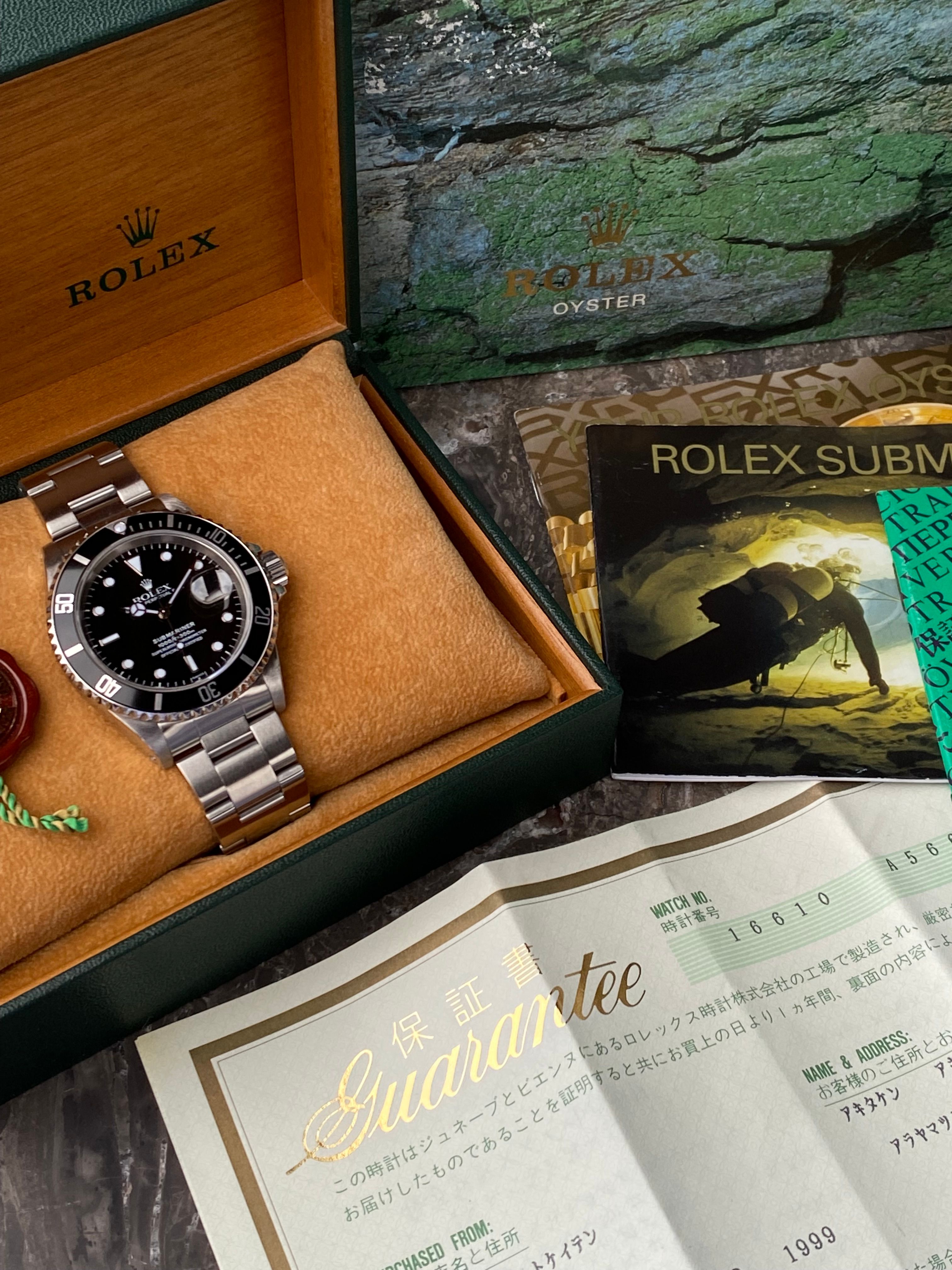 Rolex Submariner 16610 Black 1999 with original box and papers2